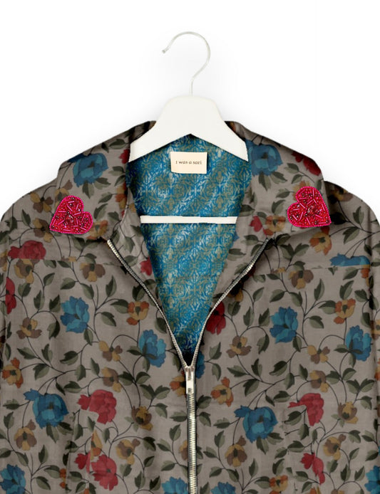 Make a bold statement with our Heart Drop Earrings, a symbol of conscious luxury and ethical fashion. Handcrafted using the intricate Aari embroidery technique, these earrings are made from upcycled sari fabric, embracing slow fashion and zero waste clothing. Elevate your look with sustainable apparel that supports fair trade fashion while reducing textile waste. Choose eco-friendly fashion that speaks of love, artistry, and responsibility.