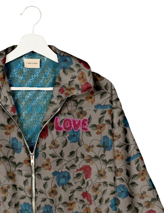 Love Bomber Jacket made from recycled fabric, featuring hand-stitched Aari embroidery. A unique piece of zero-waste clothing, part of the circular fashion movement. Designed with upcycled materials for a stylish yet environmentally friendly clothing choice.