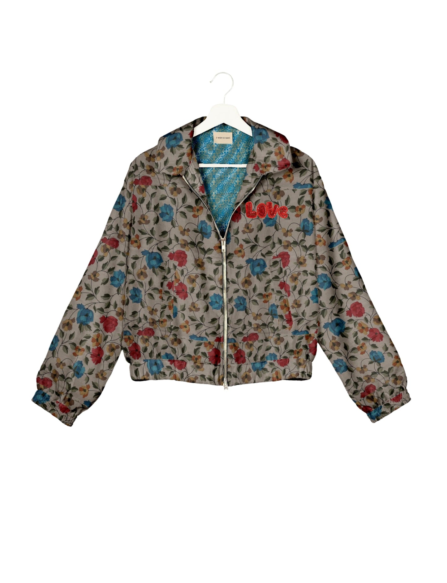 Love Bomber Jacket made from recycled fabric, featuring hand-stitched Aari embroidery. A unique piece of zero-waste clothing, part of the circular fashion movement. Designed with upcycled materials for a stylish yet environmentally friendly clothing choice.