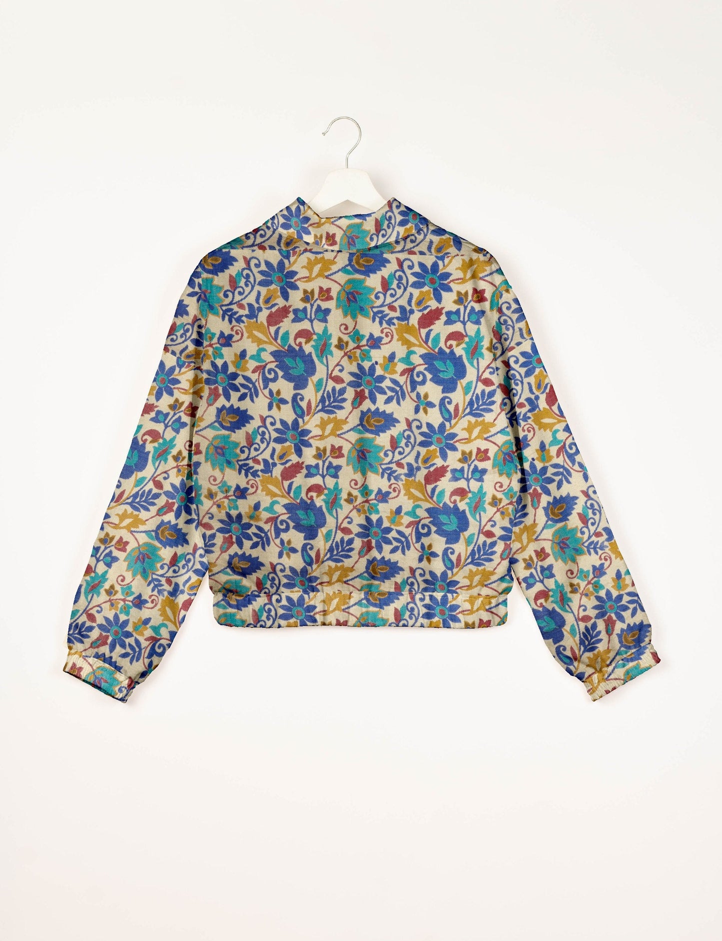 Upcycled Bomber Jacket made from recycled sari materials, featuring a cute cropped shape, elasticated hem and cuffs, and contrast sari print lining. Sustainable apparel promoting eco-friendly fashion and ethical clothing.