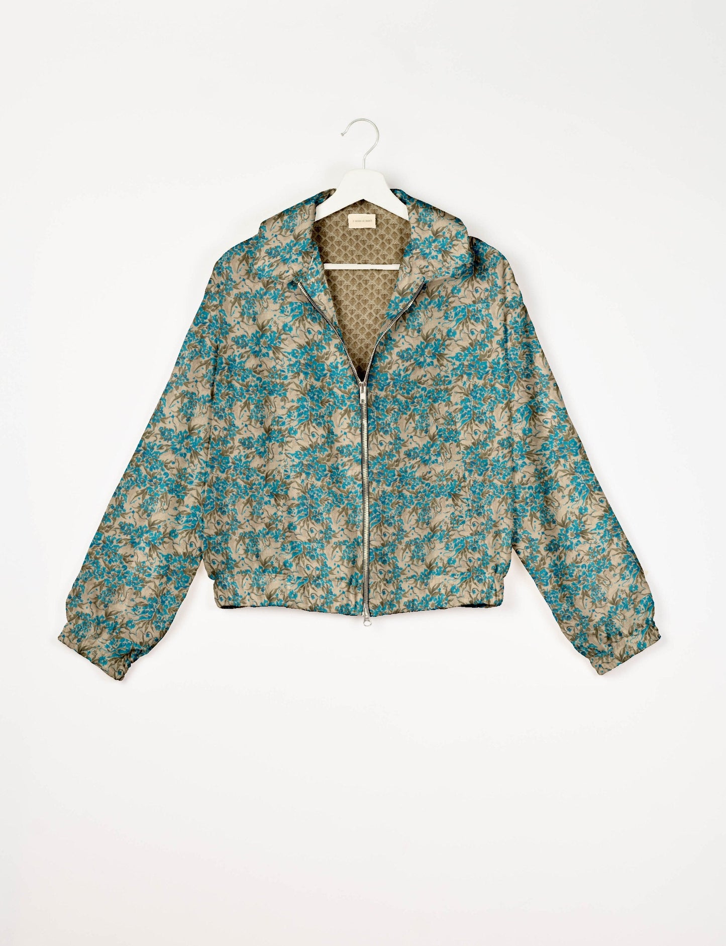 Upcycled Bomber Jacket made from recycled sari materials, featuring a cute cropped shape, elasticated hem and cuffs, and contrast sari print lining. Sustainable apparel promoting eco-friendly fashion and ethical clothing.
