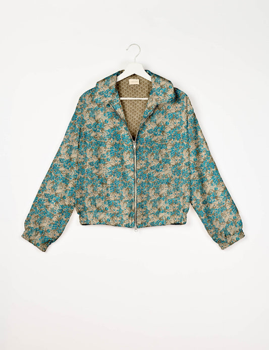 Upcycled Bomber Jacket made from recycled sari materials, featuring a cute cropped shape, elasticated hem and cuffs, and contrast sari print lining. Sustainable apparel promoting eco-friendly fashion and ethical clothing.