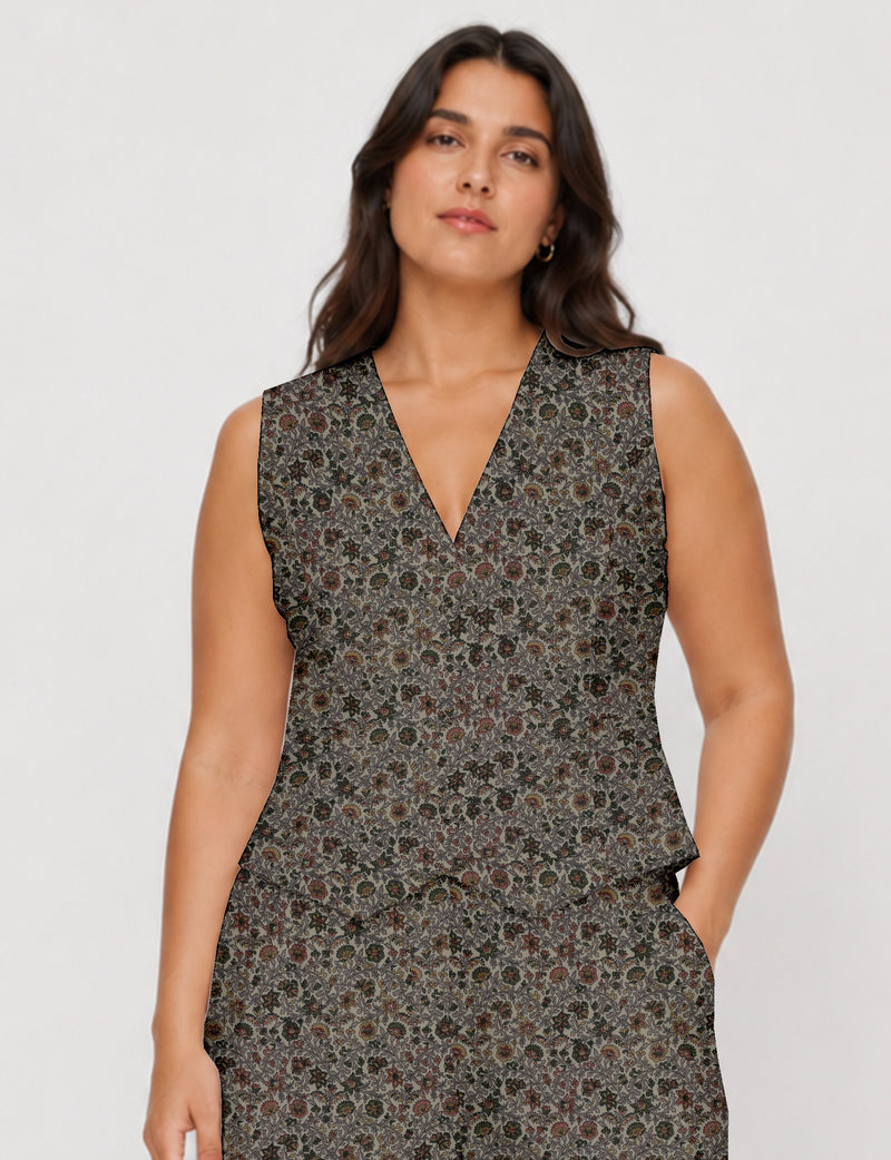 Women's fitted waistcoat with V-neck, single-breasted button closure, tailored silhouette, and pointed hem in sustainable fashion.
