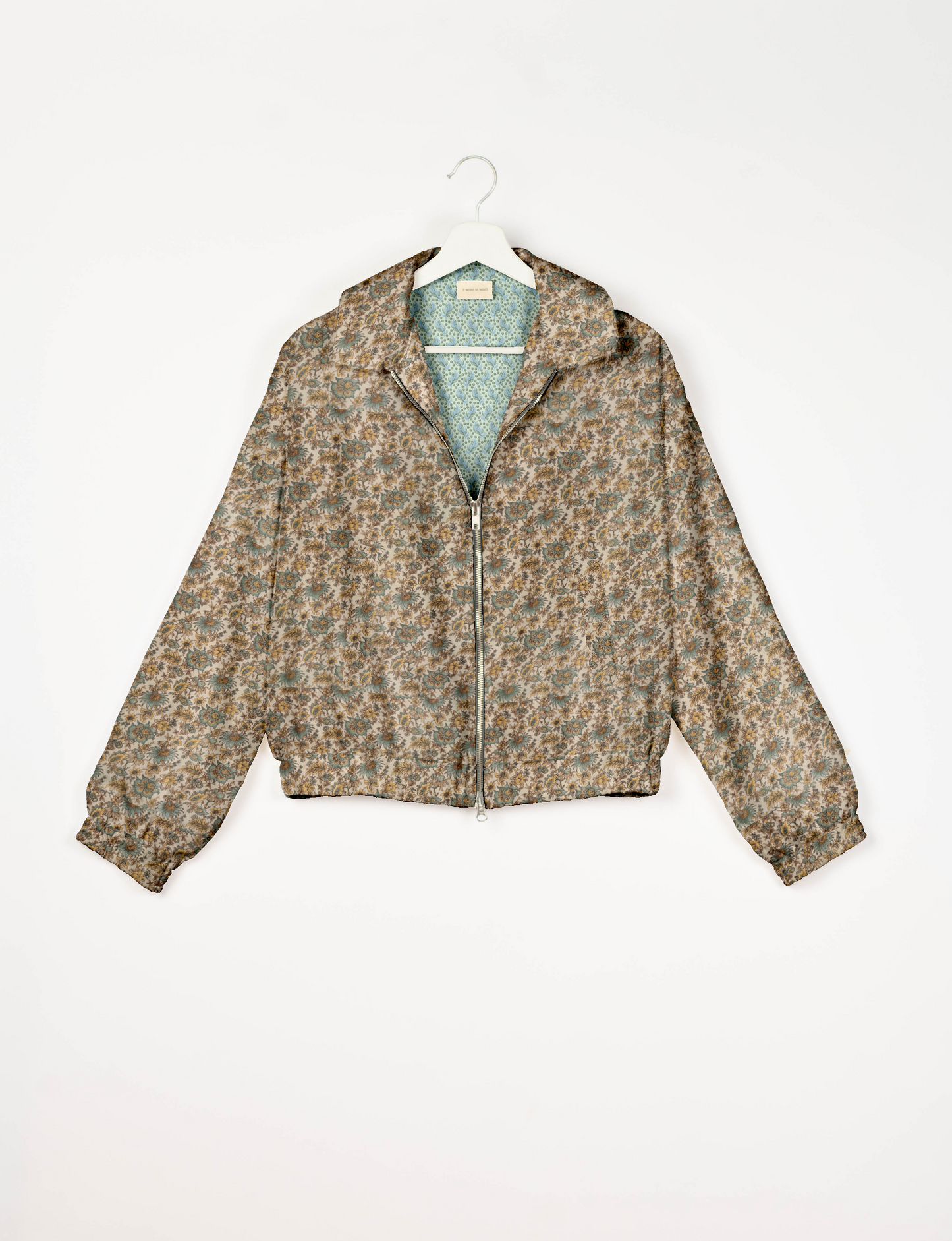 Upcycled Bomber Jacket made from recycled sari materials, featuring a cute cropped shape, elasticated hem and cuffs, and contrast sari print lining. Sustainable apparel promoting eco-friendly fashion and ethical clothing.