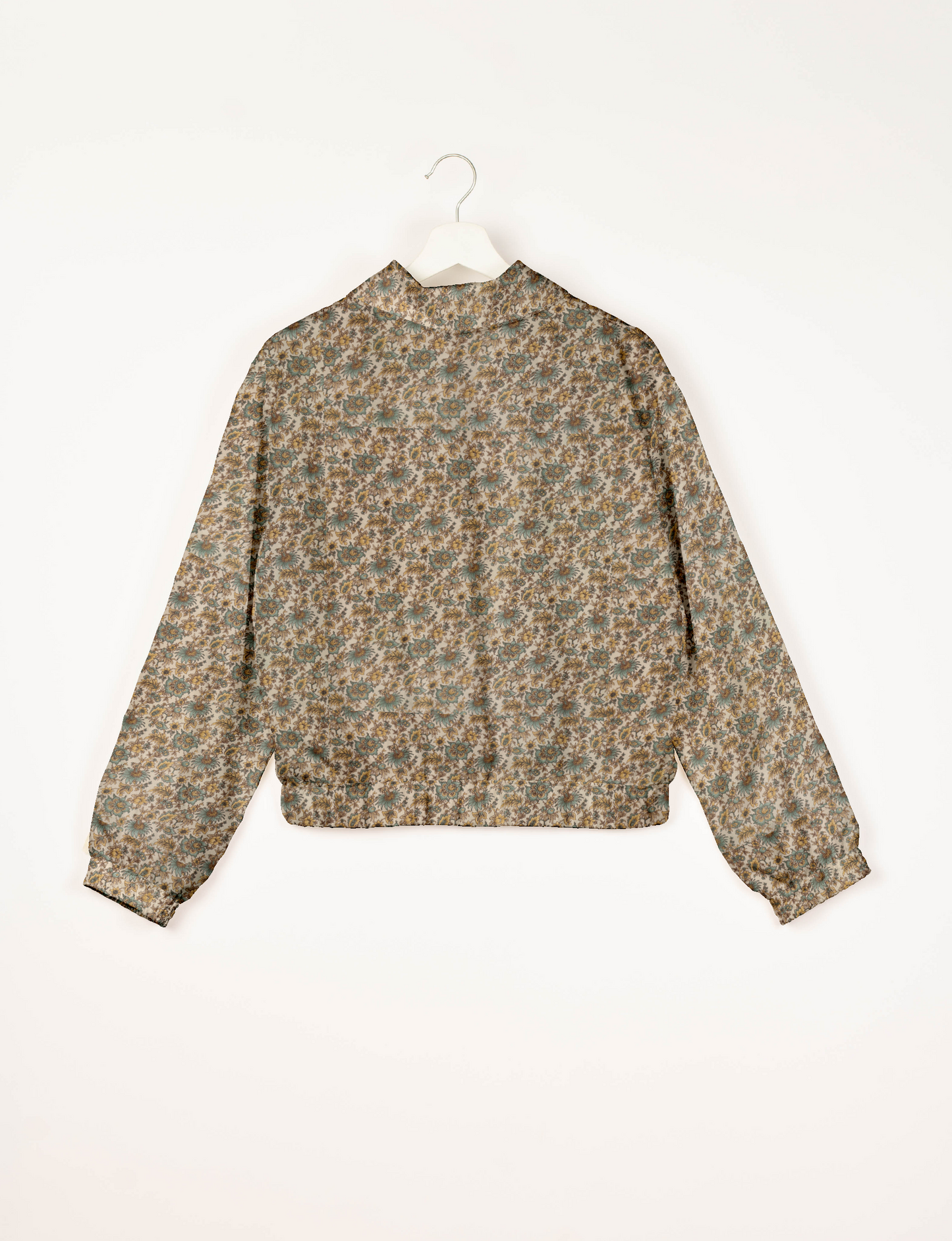 Upcycled Bomber Jacket made from recycled sari materials, featuring a cute cropped shape, elasticated hem and cuffs, and contrast sari print lining. Sustainable apparel promoting eco-friendly fashion and ethical clothing.