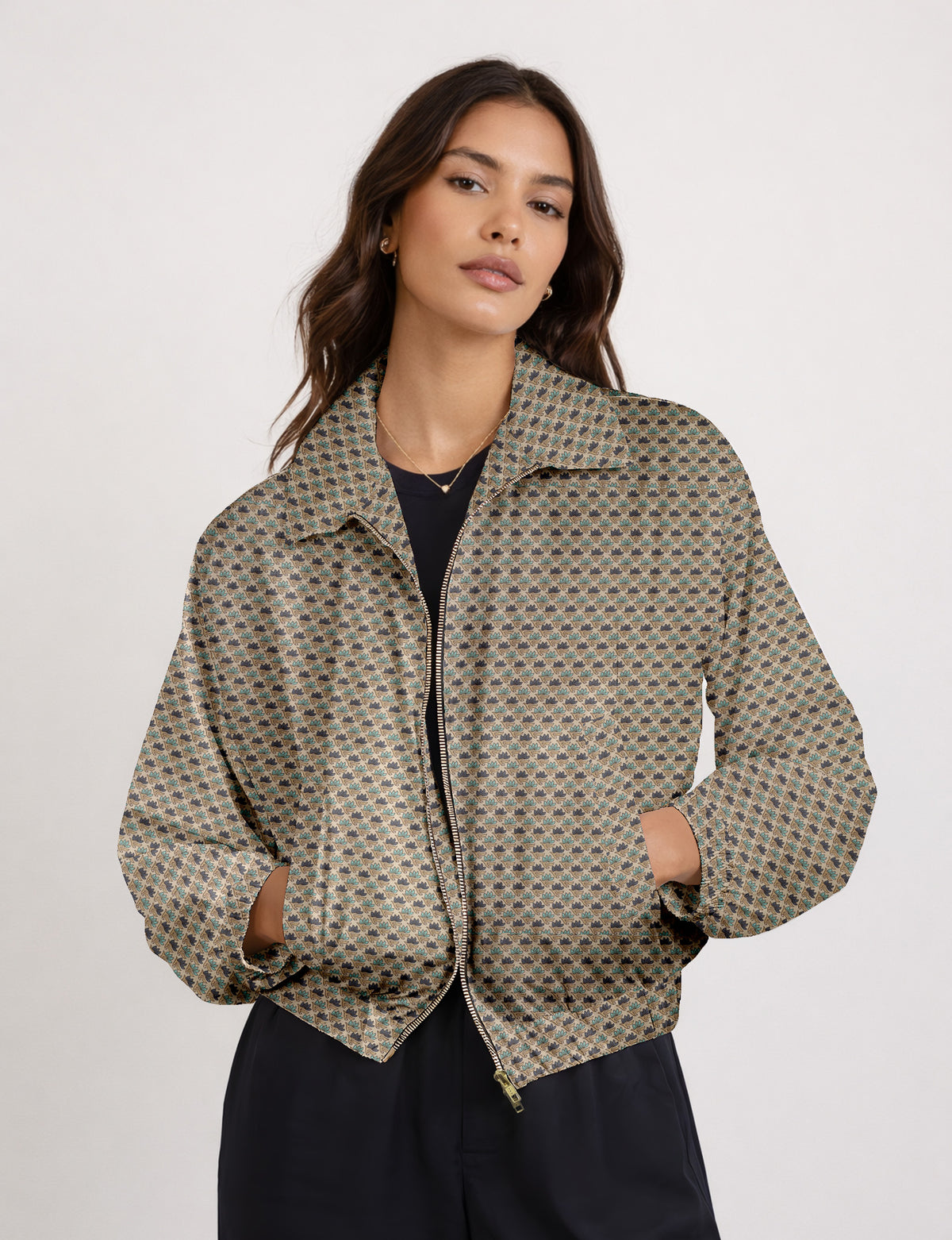 Brown floral bomber jacket with front zipper, elastic cuffs and hem, hanging on white hanger, red floral inner lining visible