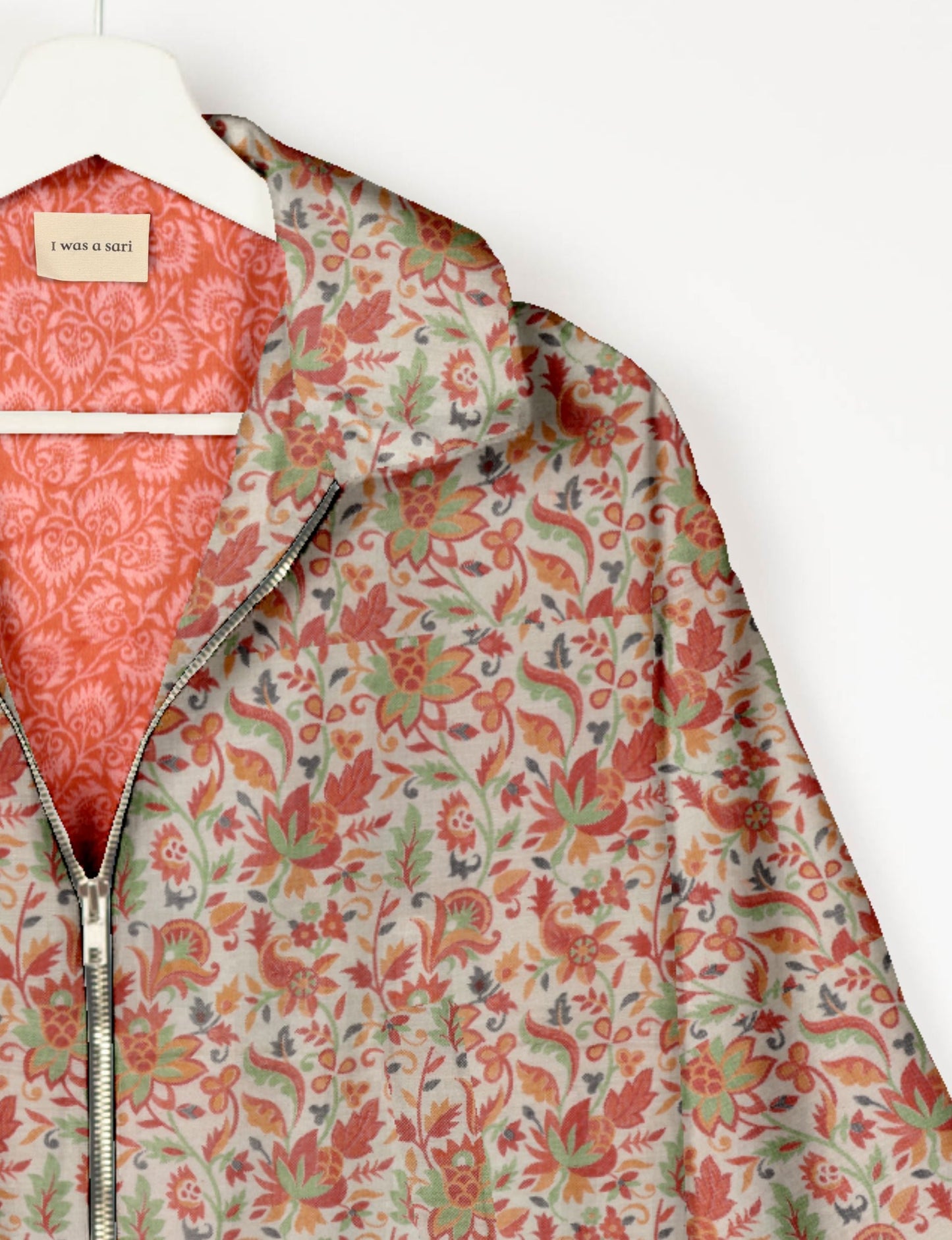 Upcycled Bomber Jacket made from recycled sari materials, featuring a cute cropped shape, elasticated hem and cuffs, and contrast sari print lining. Sustainable apparel promoting eco-friendly fashion and ethical clothing.