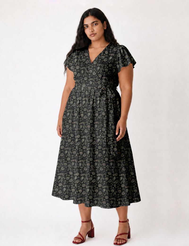 Elegant midi wrap dress with a V-neckline, adjustable waist tie, fitted bodice, and flared skirt for a timeless, flattering silhouette.