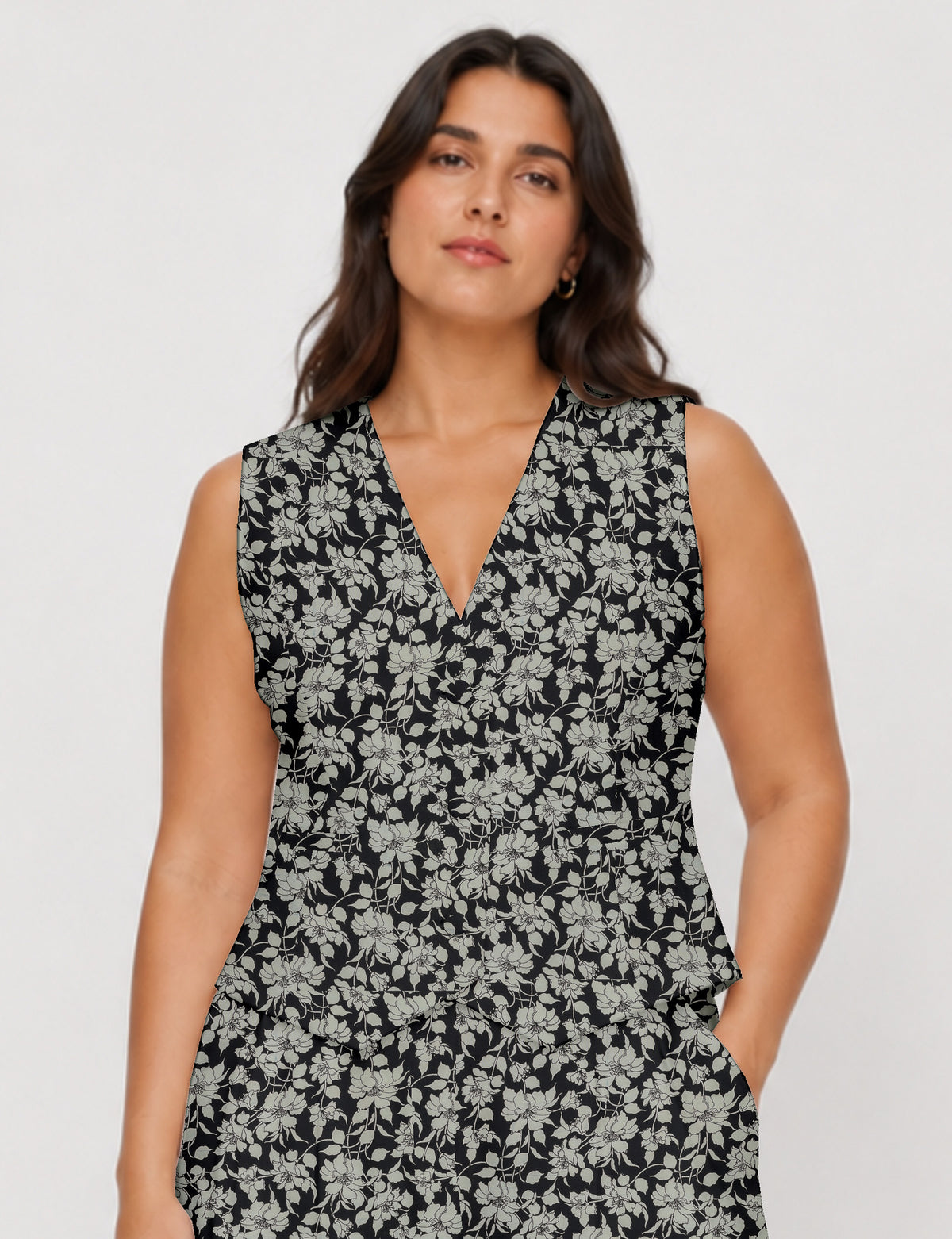 Women's fitted waistcoat with V-neck, single-breasted button closure, tailored silhouette, and pointed hem in sustainable fashion.