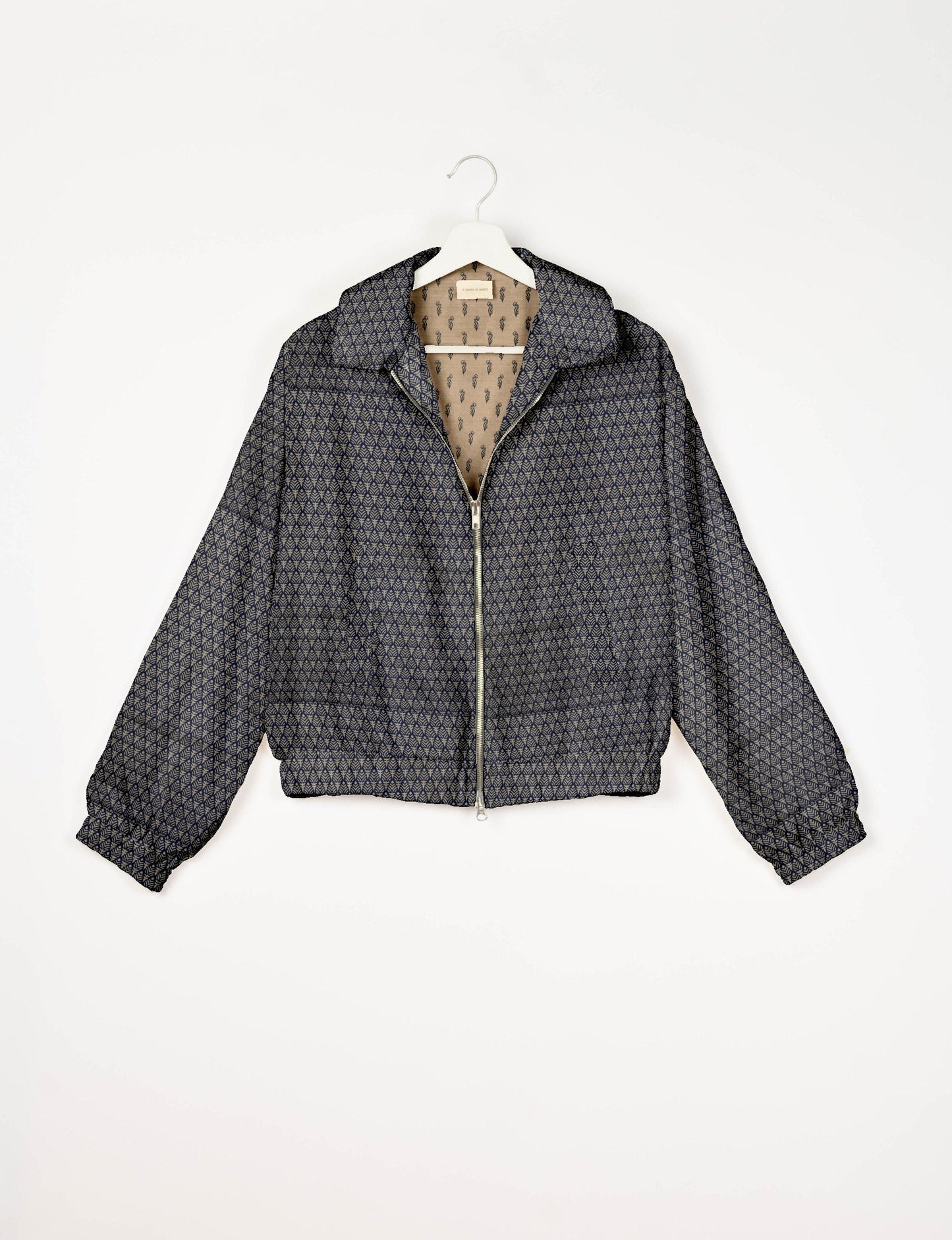 Upcycled Bomber Jacket made from recycled sari materials, featuring a cute cropped shape, elasticated hem and cuffs, and contrast sari print lining. Sustainable apparel promoting eco-friendly fashion and ethical clothing.