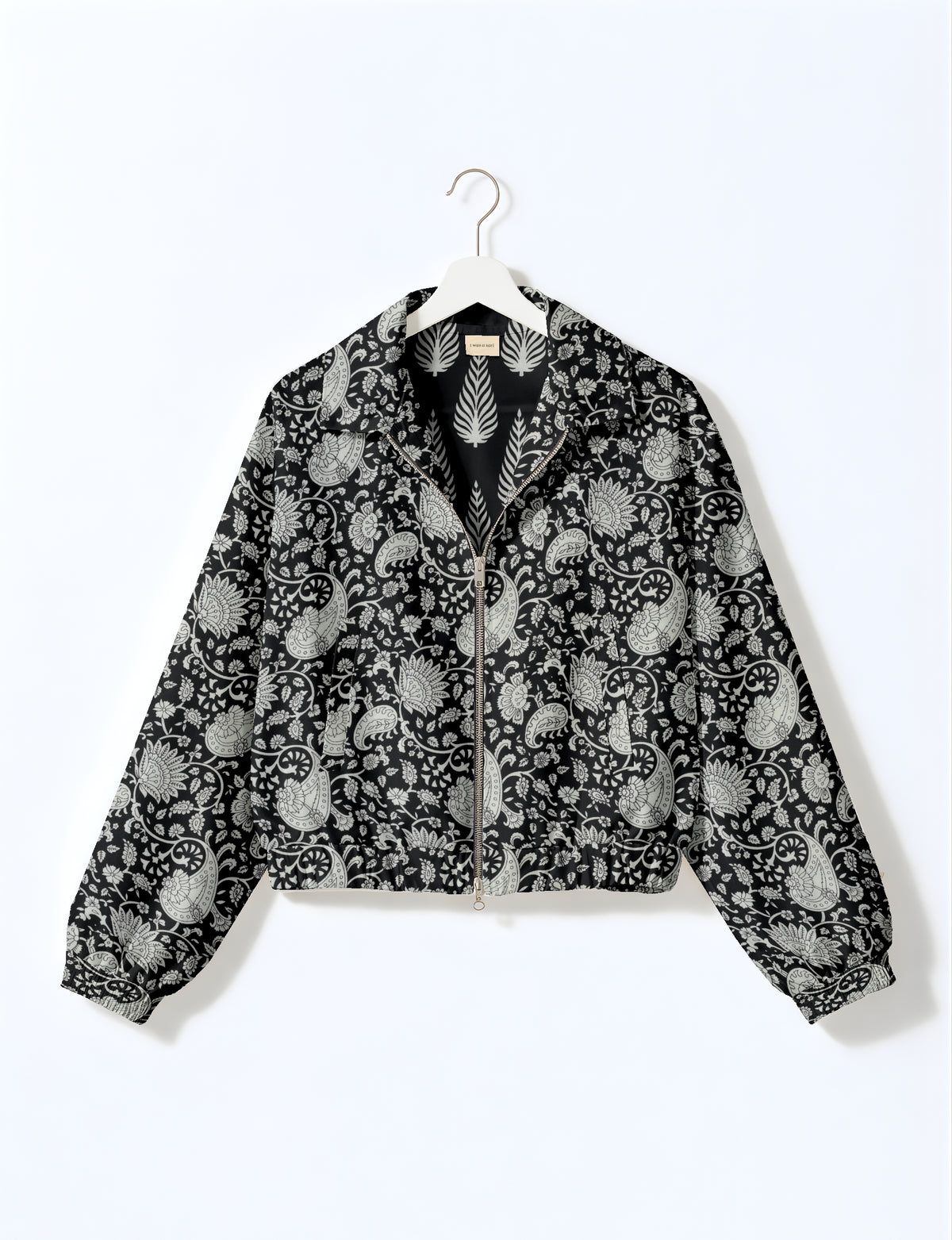 Upcycled Bomber Jacket made from recycled sari materials, featuring a cute cropped shape, elasticated hem and cuffs, and contrast sari print lining. Sustainable apparel promoting eco-friendly fashion and ethical clothing.