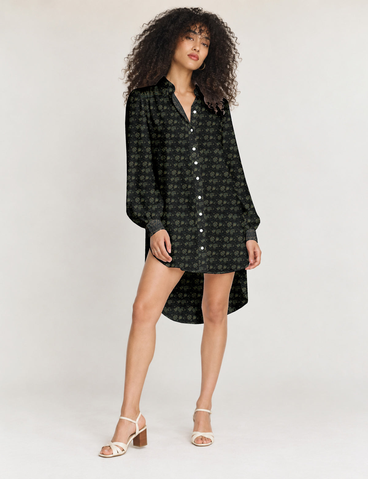 High low shirt with a relaxed fit, button-down front, classic collar, gathered shoulders and full-length blouson sleeves.
