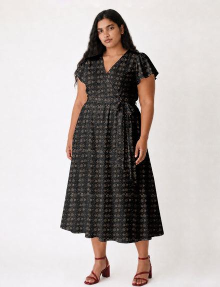 Elegant midi wrap dress with a V-neckline, adjustable waist tie, fitted bodice, and flared skirt for a timeless, flattering silhouette.