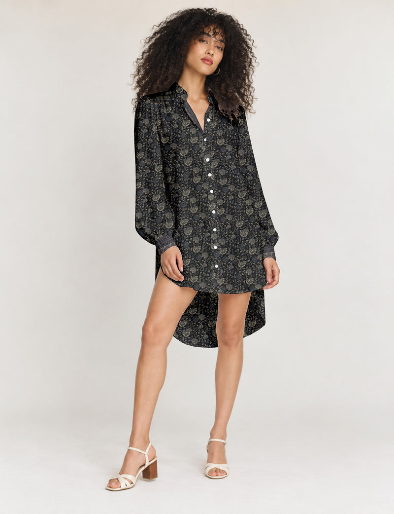 High low shirt with a relaxed fit, button-down front, classic collar, gathered shoulders and full-length blouson sleeves.