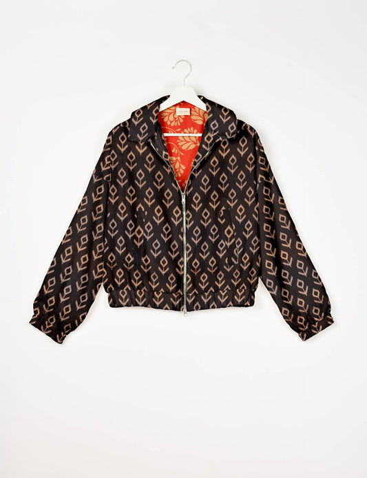 Stylish BOMBER JACKET, an upcycled clothing masterpiece with a cute cropped shape, elasticated details, and detachable metallic zipper. Contrast sari print lining adds a unique touch. Explore sustainable and eco-friendly fashion.