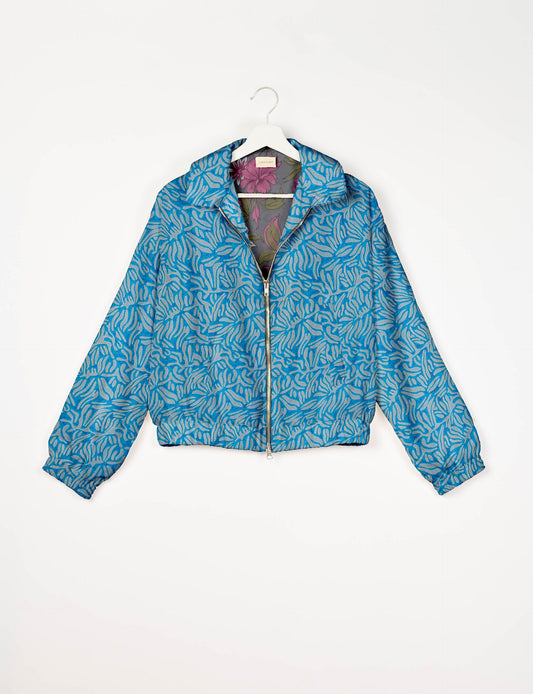 Upcycled Bomber Jacket made from recycled sari materials, featuring a cute cropped shape, elasticated hem and cuffs, and contrast sari print lining. Sustainable apparel promoting eco-friendly fashion and ethical clothing.