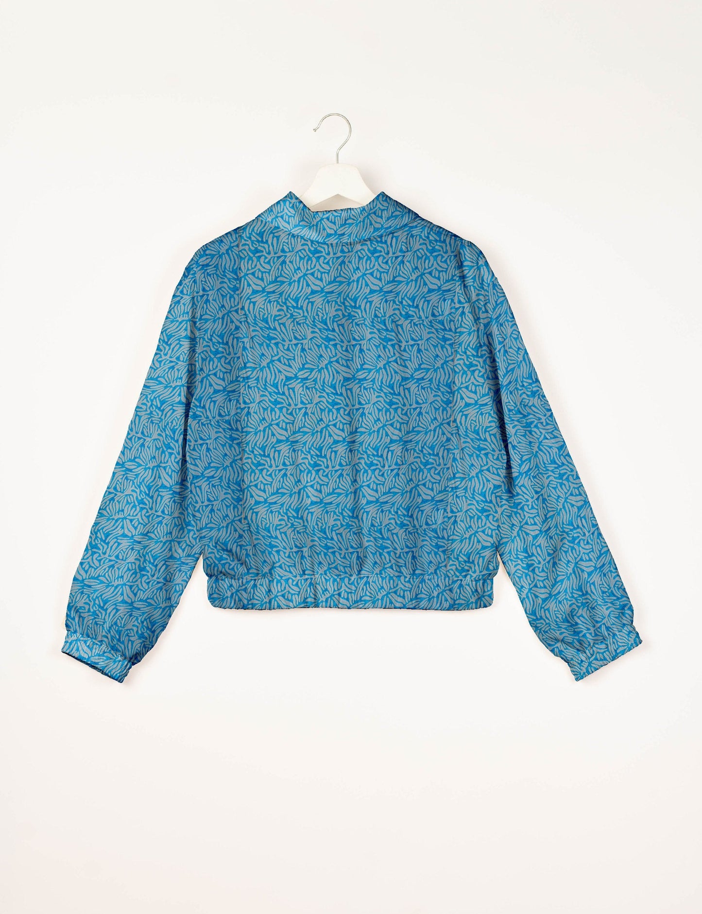 Love Bomber Jacket made from recycled fabric, featuring hand-stitched Aari embroidery. A unique piece of zero-waste clothing, part of the circular fashion movement. Designed with upcycled materials for a stylish yet environmentally friendly clothing choice.