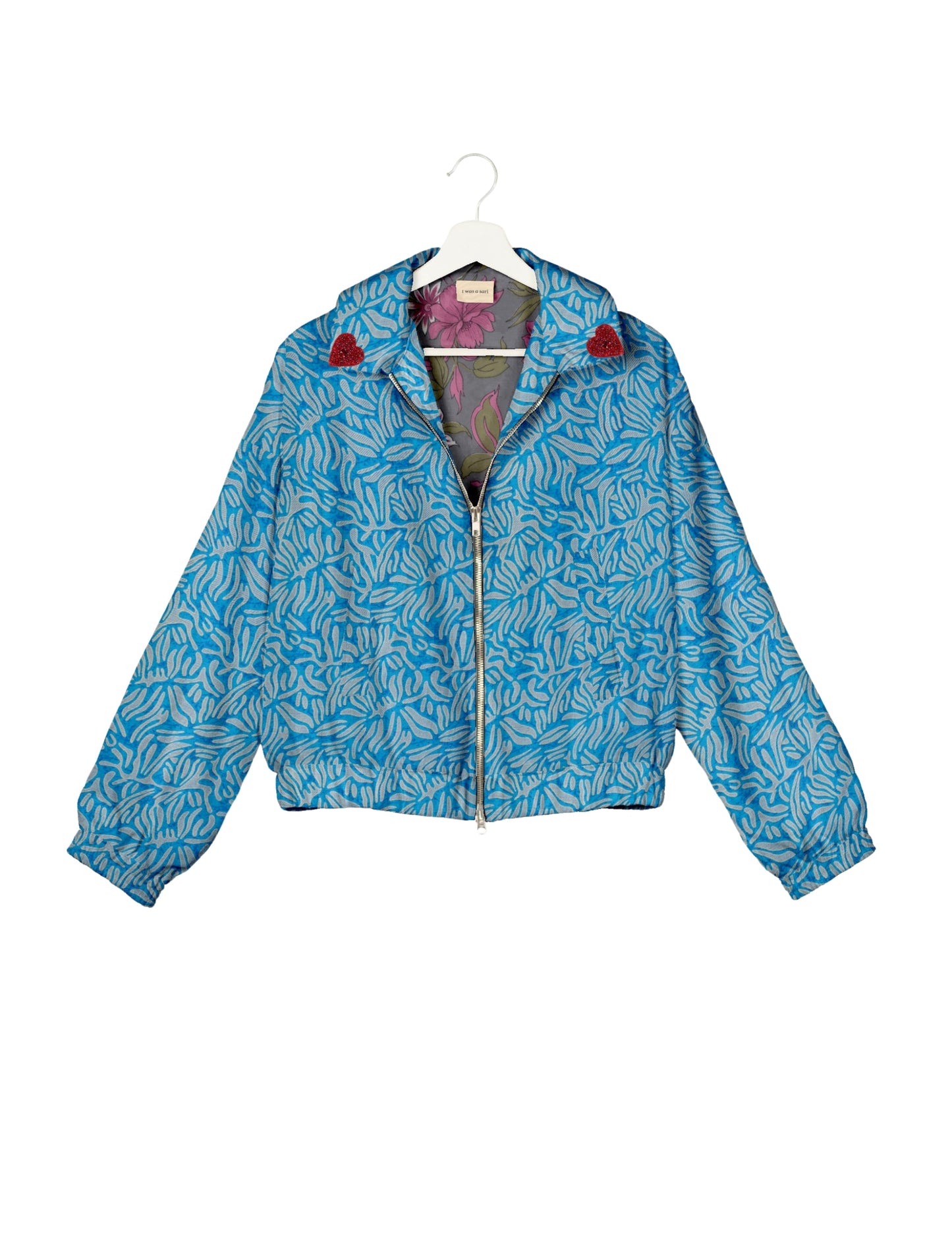 Make a bold statement with our Heart Drop Earrings, a symbol of conscious luxury and ethical fashion. Handcrafted using the intricate Aari embroidery technique, these earrings are made from upcycled sari fabric, embracing slow fashion and zero waste clothing. Elevate your look with sustainable apparel that supports fair trade fashion while reducing textile waste. Choose eco-friendly fashion that speaks of love, artistry, and responsibility.