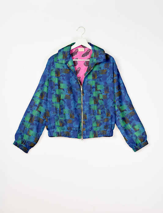 Stylish BOMBER JACKET, an upcycled clothing masterpiece with a cute cropped shape, elasticated details, and detachable metallic zipper. Contrast sari print lining adds a unique touch. Explore sustainable and eco-friendly fashion.