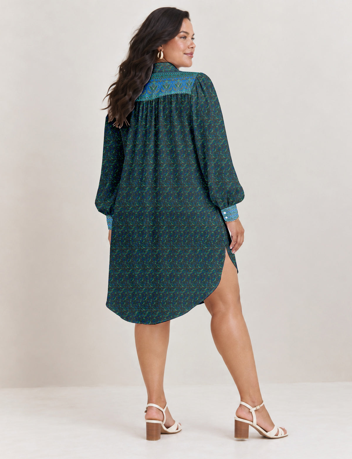 High low shirt with a relaxed fit, button-down front, classic collar, gathered shoulders and full-length blouson sleeves.