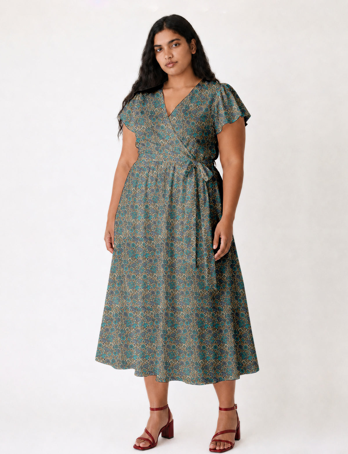 Elegant midi wrap dress with a V-neckline, adjustable waist tie, fitted bodice, and flared skirt for a timeless, flattering silhouette.
