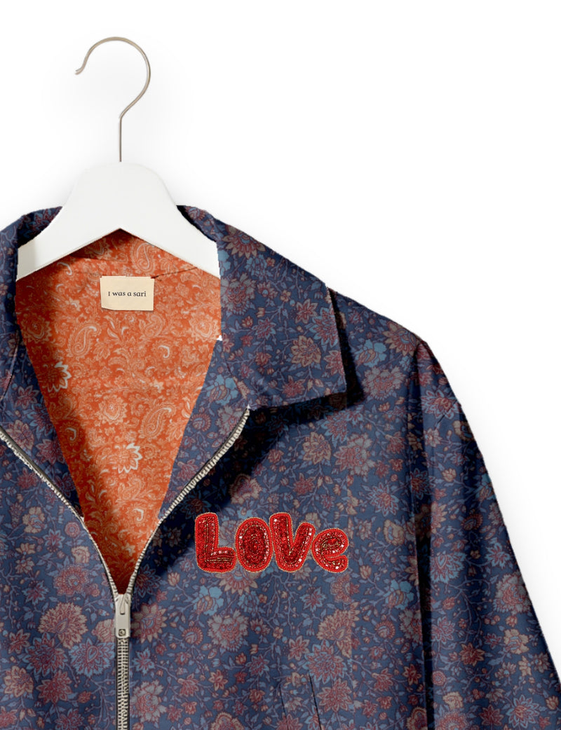 Love Bomber Jacket made from recycled fabric, featuring hand-stitched Aari embroidery. A unique piece of zero-waste clothing, part of the circular fashion movement. Designed with upcycled materials for a stylish yet environmentally friendly clothing choice.