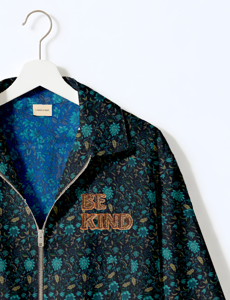 BE KIND Bomber jacket made from upcycled sari fabric with handcrafted Aari embroidery by female artisans.