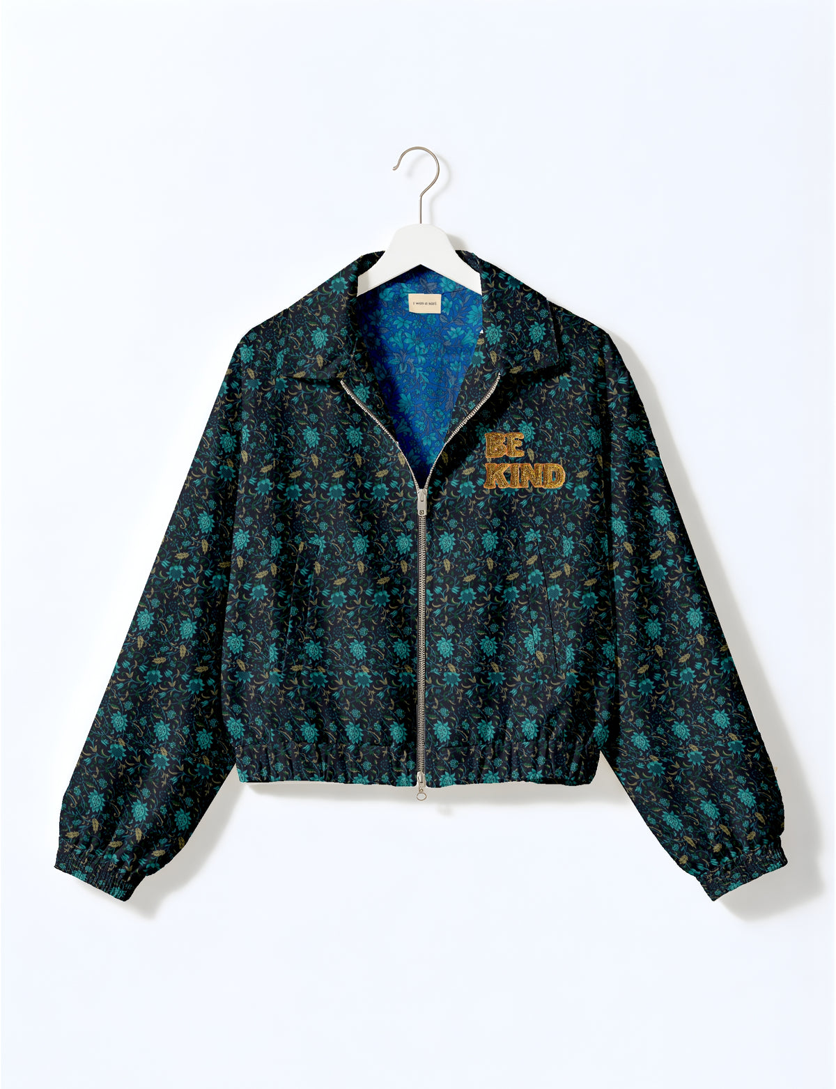 BE KIND Bomber jacket made from upcycled sari fabric with handcrafted Aari embroidery by female artisans.