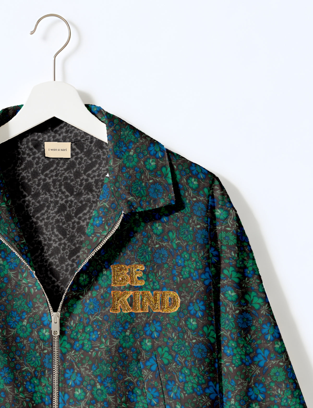 BE KIND Bomber jacket made from upcycled sari fabric with handcrafted Aari embroidery by female artisans.