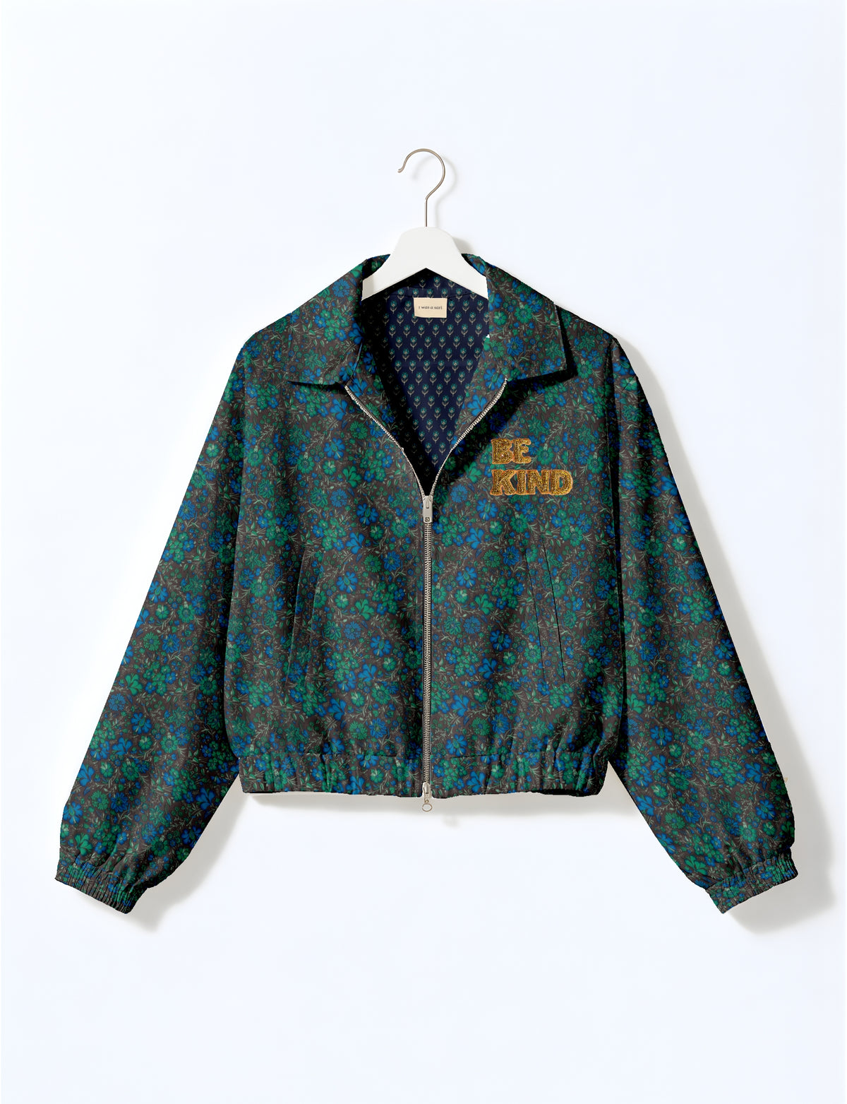 BE KIND Bomber jacket made from upcycled sari fabric with handcrafted Aari embroidery by female artisans.