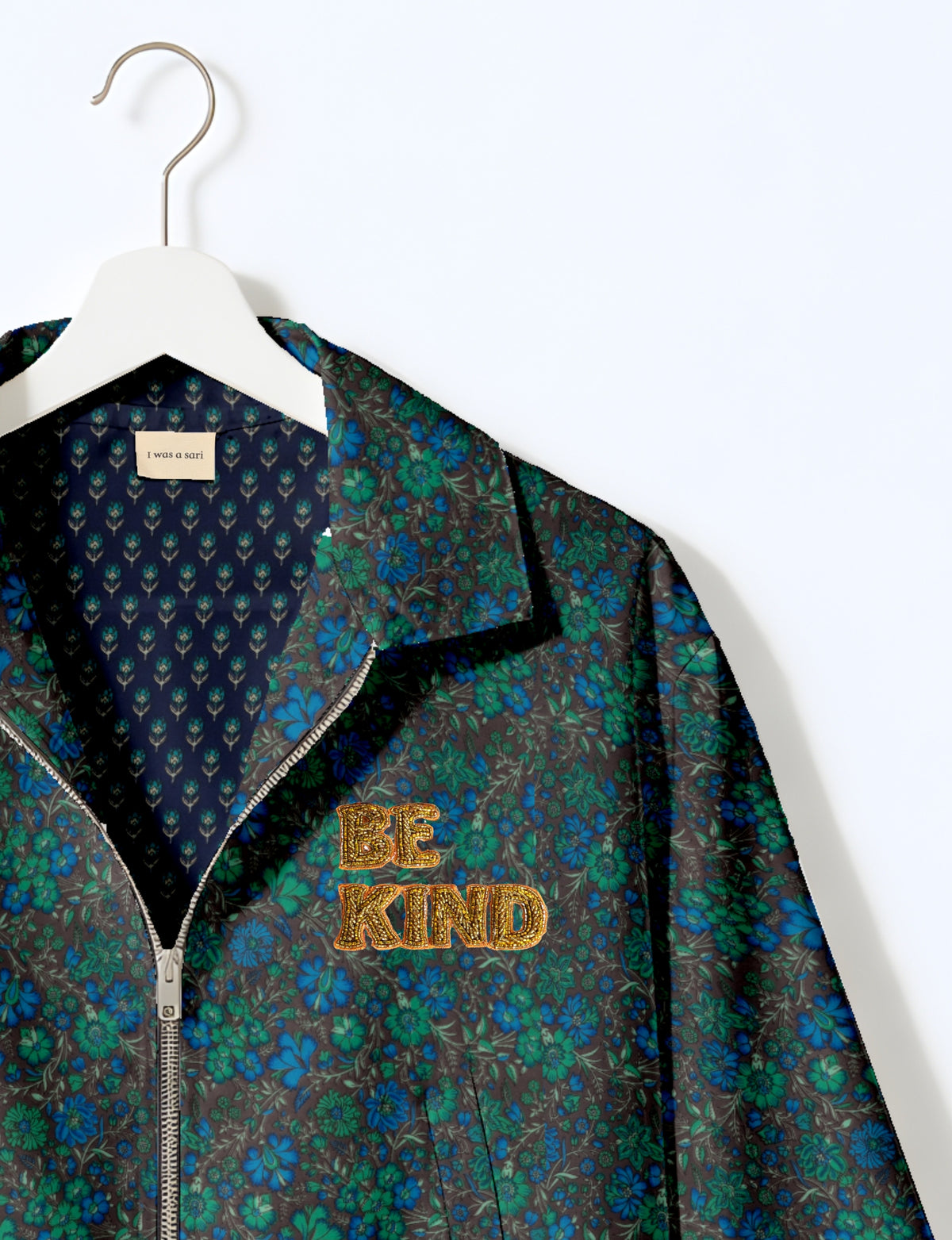 BE KIND Bomber jacket made from upcycled sari fabric with handcrafted Aari embroidery by female artisans.