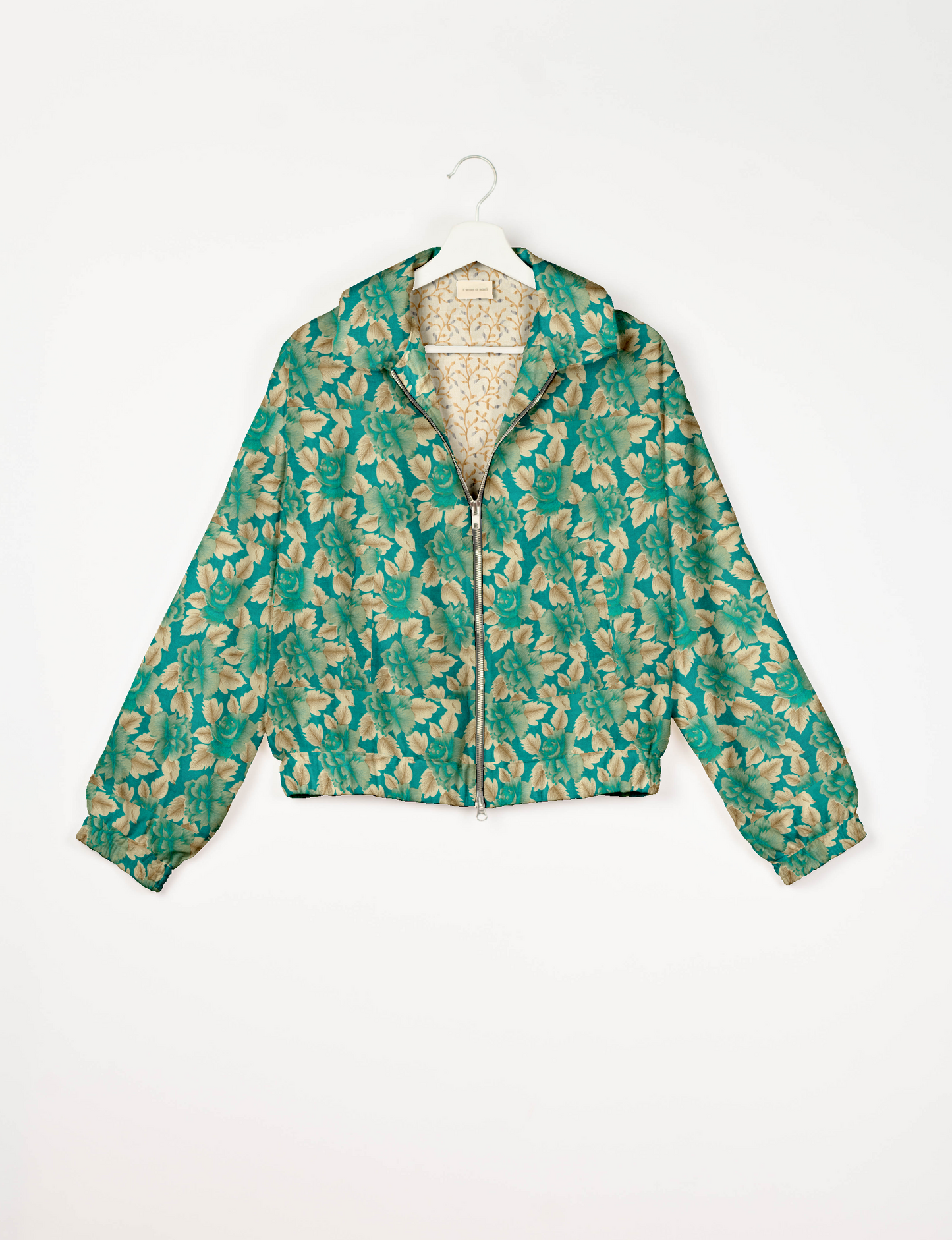 Upcycled Bomber Jacket made from recycled sari materials, featuring a cute cropped shape, elasticated hem and cuffs, and contrast sari print lining. Sustainable apparel promoting eco-friendly fashion and ethical clothing.