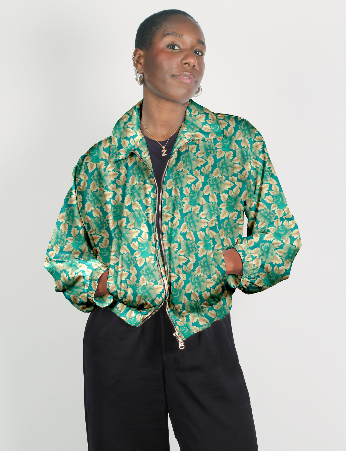 Upcycled Bomber Jacket made from recycled sari materials, featuring a cute cropped shape, elasticated hem and cuffs, and contrast sari print lining. Sustainable apparel promoting eco-friendly fashion and ethical clothing.