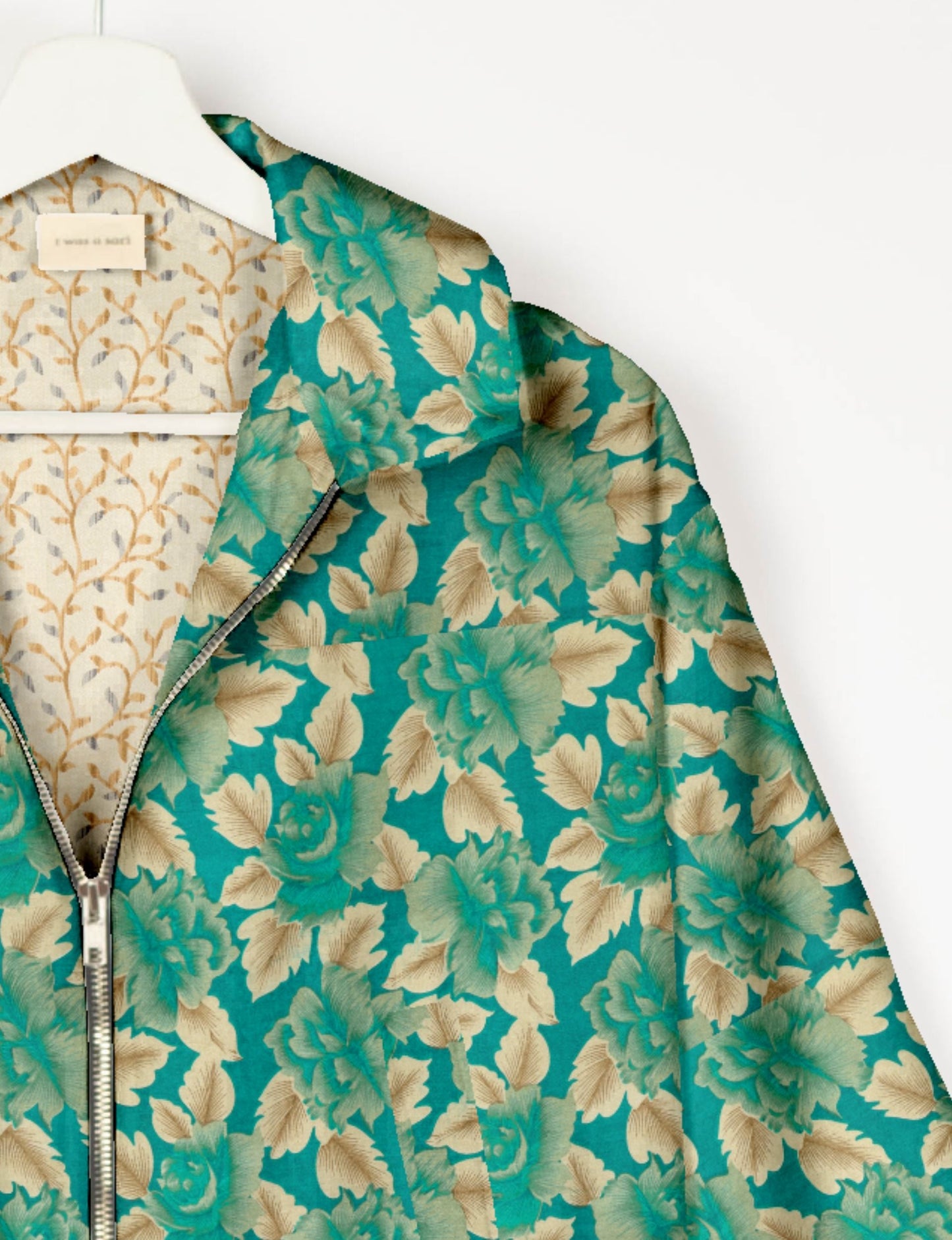 Upcycled Bomber Jacket made from recycled sari materials, featuring a cute cropped shape, elasticated hem and cuffs, and contrast sari print lining. Sustainable apparel promoting eco-friendly fashion and ethical clothing.