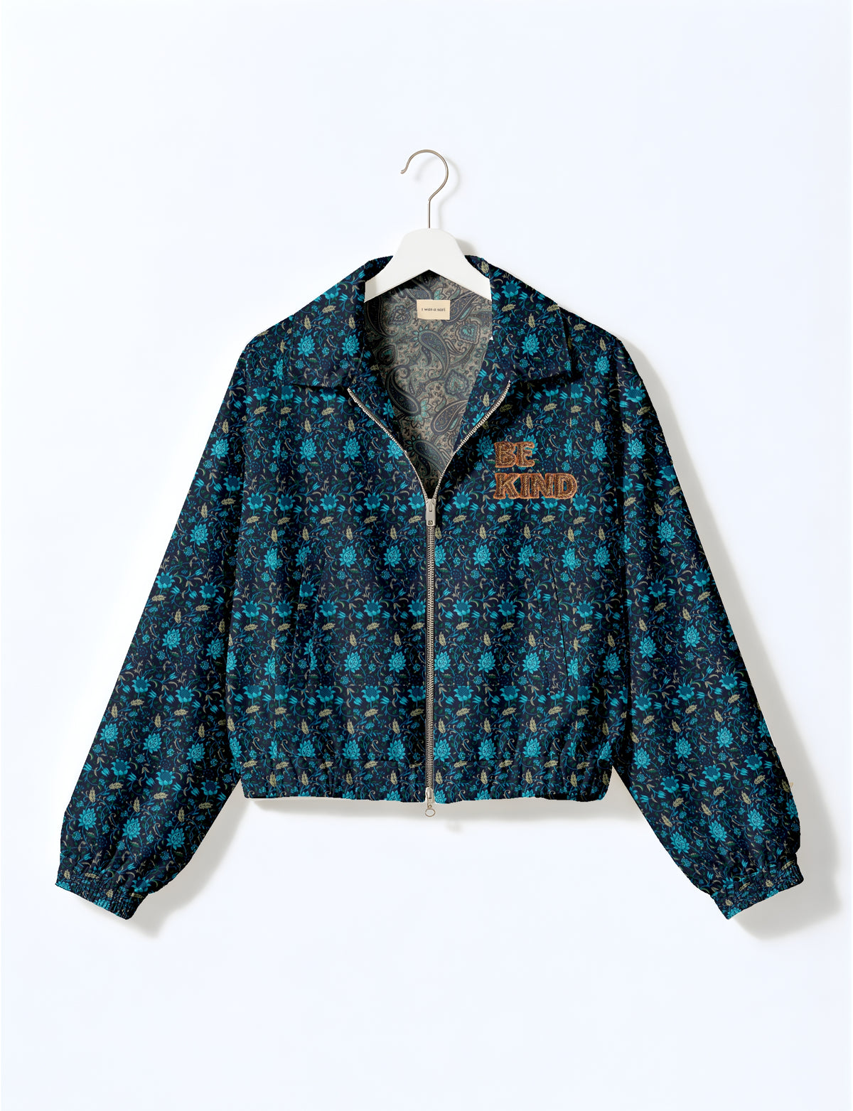 BE KIND Bomber jacket made from upcycled sari fabric with handcrafted Aari embroidery by female artisans.