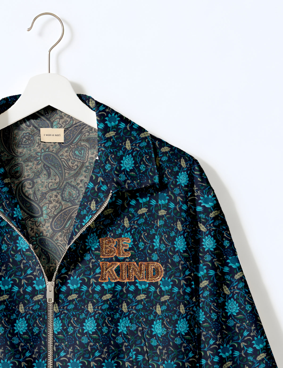 BE KIND Bomber jacket made from upcycled sari fabric with handcrafted Aari embroidery by female artisans.