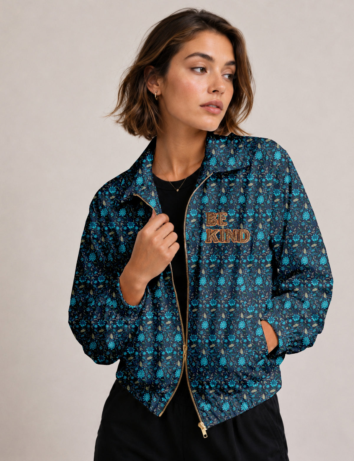 BE KIND Bomber jacket made from upcycled sari fabric with handcrafted Aari embroidery by female artisans.
