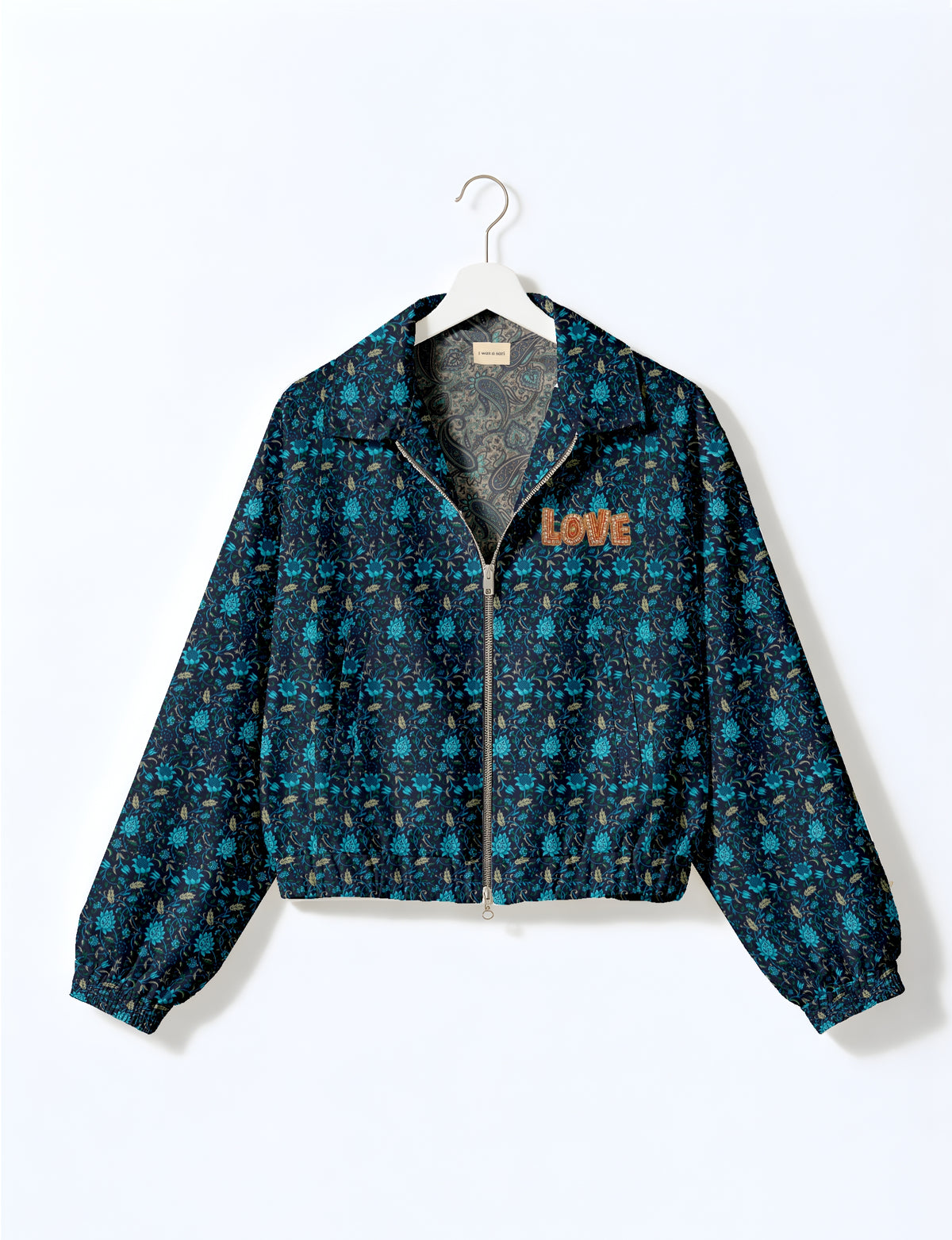 Love Bomber Jacket made from recycled fabric, featuring hand-stitched Aari embroidery. A unique piece of zero-waste clothing, part of the circular fashion movement. Designed with upcycled materials for a stylish yet environmentally friendly clothing choice.