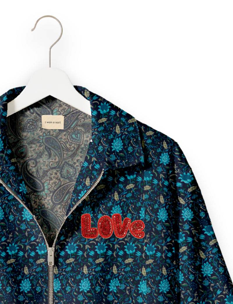 Love Bomber Jacket made from recycled fabric, featuring hand-stitched Aari embroidery. A unique piece of zero-waste clothing, part of the circular fashion movement. Designed with upcycled materials for a stylish yet environmentally friendly clothing choice.
