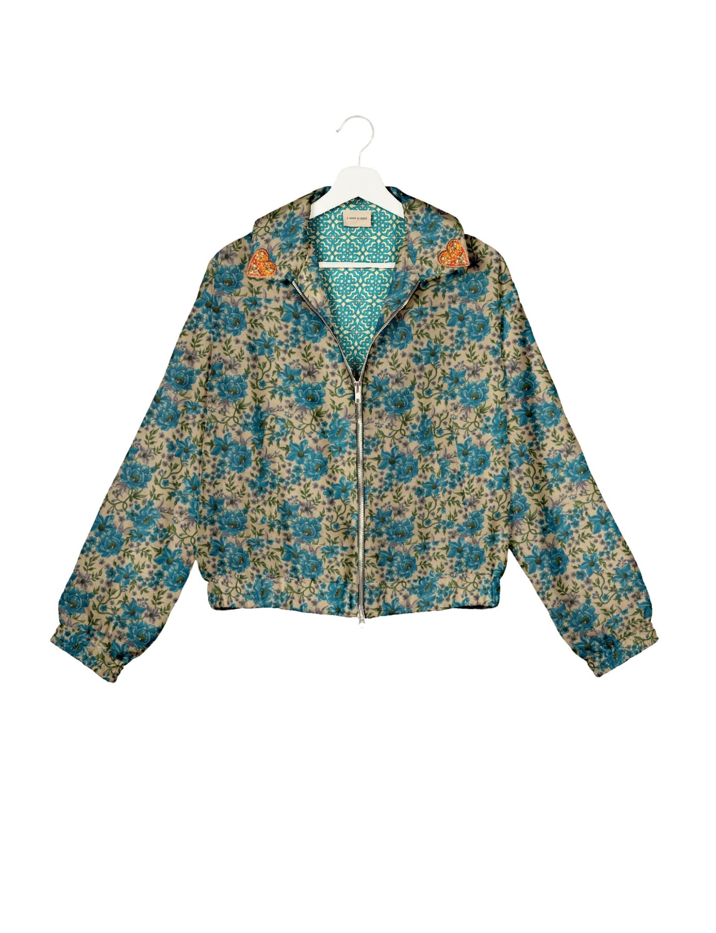 Make a bold statement with our Heart Drop Earrings, a symbol of conscious luxury and ethical fashion. Handcrafted using the intricate Aari embroidery technique, these earrings are made from upcycled sari fabric, embracing slow fashion and zero waste clothing. Elevate your look with sustainable apparel that supports fair trade fashion while reducing textile waste. Choose eco-friendly fashion that speaks of love, artistry, and responsibility.