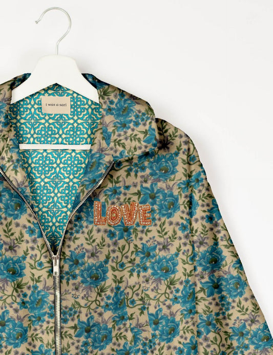Love Bomber Jacket made from recycled fabric, featuring hand-stitched Aari embroidery. A unique piece of zero-waste clothing, part of the circular fashion movement. Designed with upcycled materials for a stylish yet environmentally friendly clothing choice.