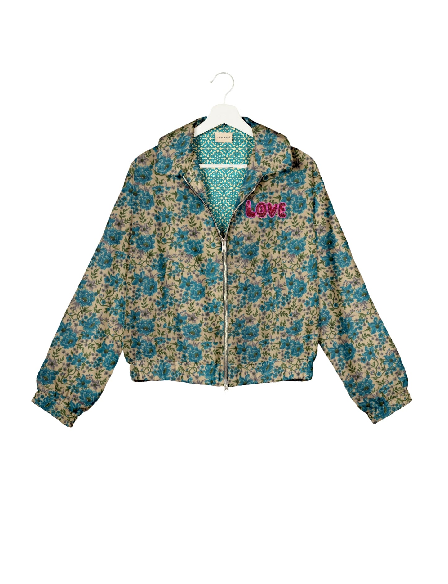 Love Bomber Jacket made from recycled fabric, featuring hand-stitched Aari embroidery. A unique piece of zero-waste clothing, part of the circular fashion movement. Designed with upcycled materials for a stylish yet environmentally friendly clothing choice.