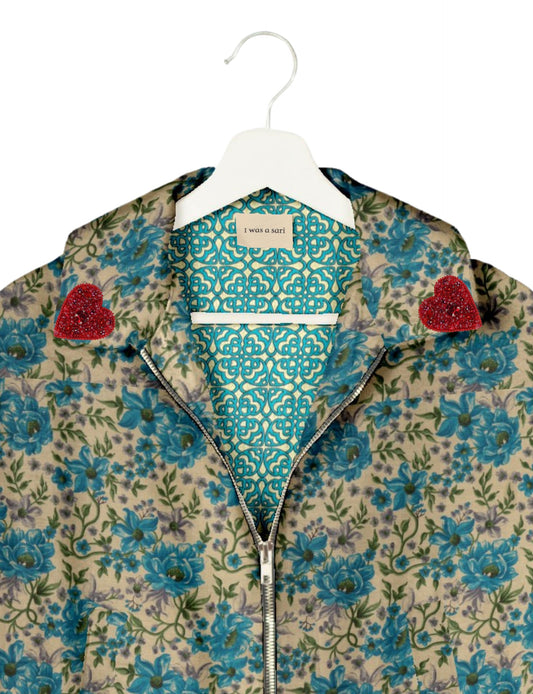 Make a bold statement with our Heart Drop Earrings, a symbol of conscious luxury and ethical fashion. Handcrafted using the intricate Aari embroidery technique, these earrings are made from upcycled sari fabric, embracing slow fashion and zero waste clothing. Elevate your look with sustainable apparel that supports fair trade fashion while reducing textile waste. Choose eco-friendly fashion that speaks of love, artistry, and responsibility.