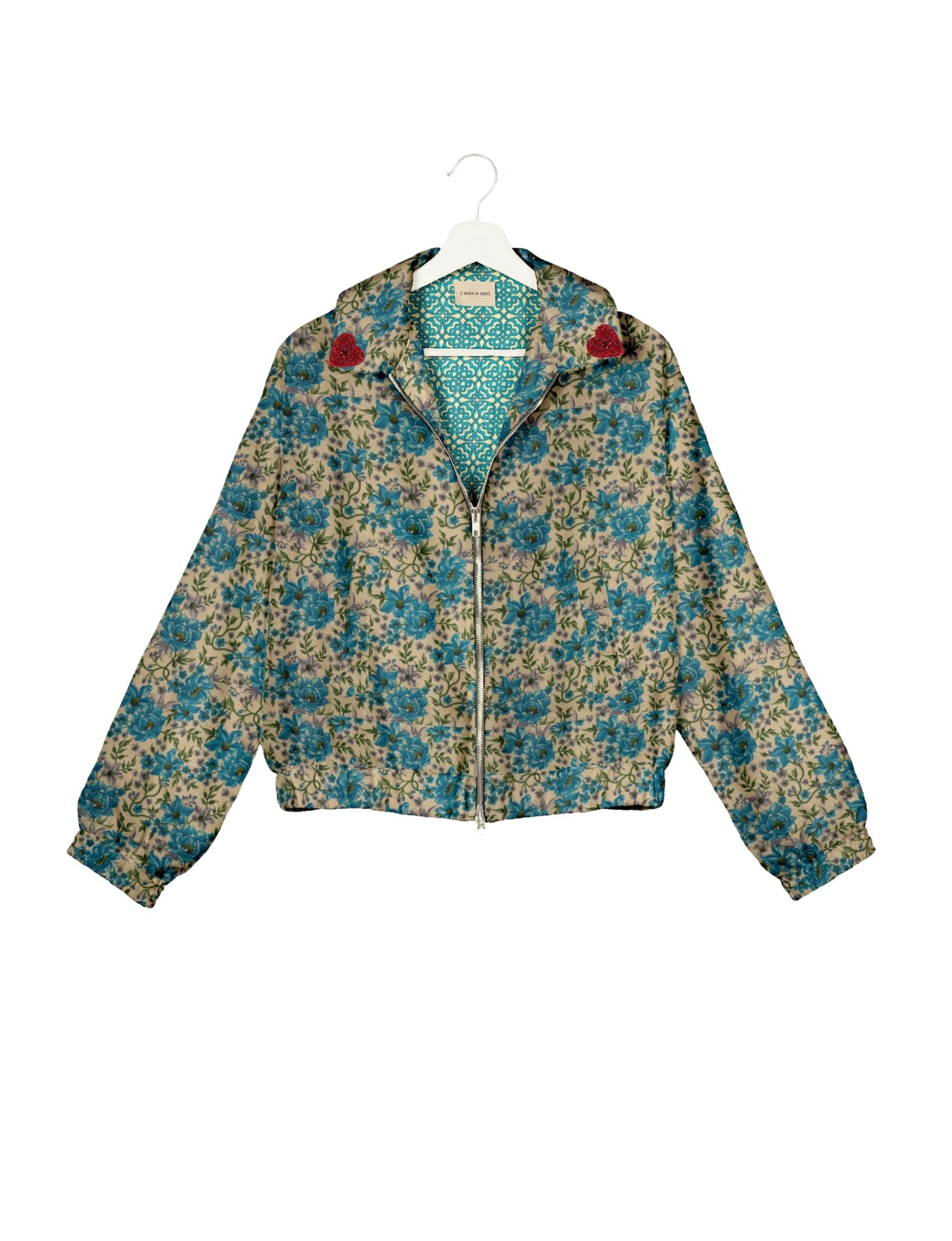 Make a bold statement with our Heart Drop Earrings, a symbol of conscious luxury and ethical fashion. Handcrafted using the intricate Aari embroidery technique, these earrings are made from upcycled sari fabric, embracing slow fashion and zero waste clothing. Elevate your look with sustainable apparel that supports fair trade fashion while reducing textile waste. Choose eco-friendly fashion that speaks of love, artistry, and responsibility.