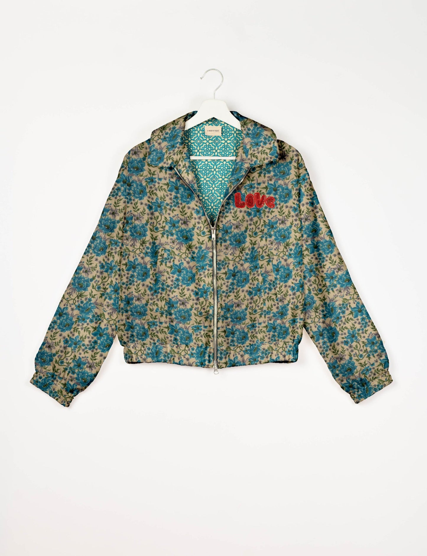 Love Bomber Jacket made from recycled fabric, featuring hand-stitched Aari embroidery. A unique piece of zero-waste clothing, part of the circular fashion movement. Designed with upcycled materials for a stylish yet environmentally friendly clothing choice.