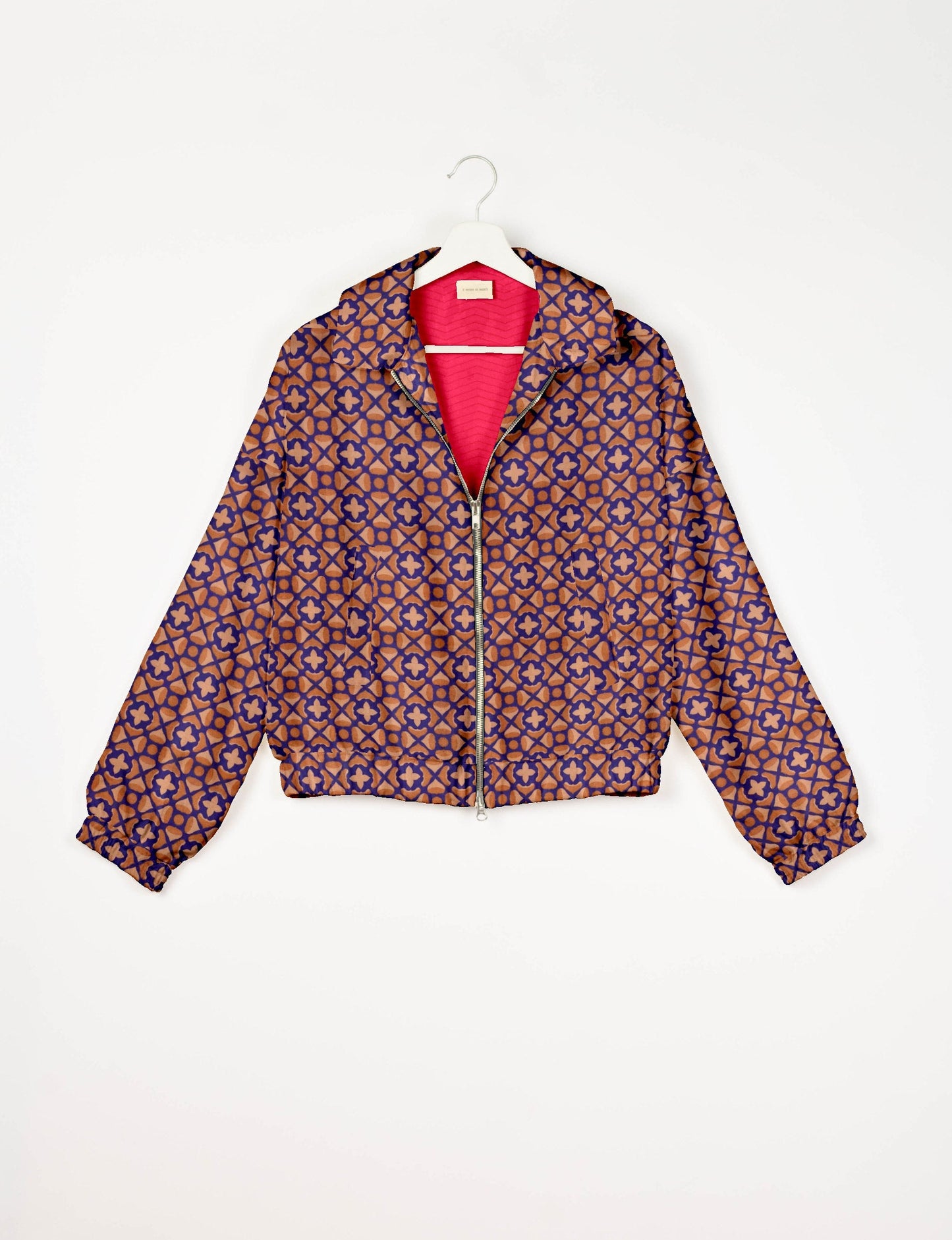 Stylish BOMBER JACKET, an upcycled clothing masterpiece with a cute cropped shape, elasticated details, and detachable metallic zipper. Contrast sari print lining adds a unique touch. Explore sustainable and eco-friendly fashion.