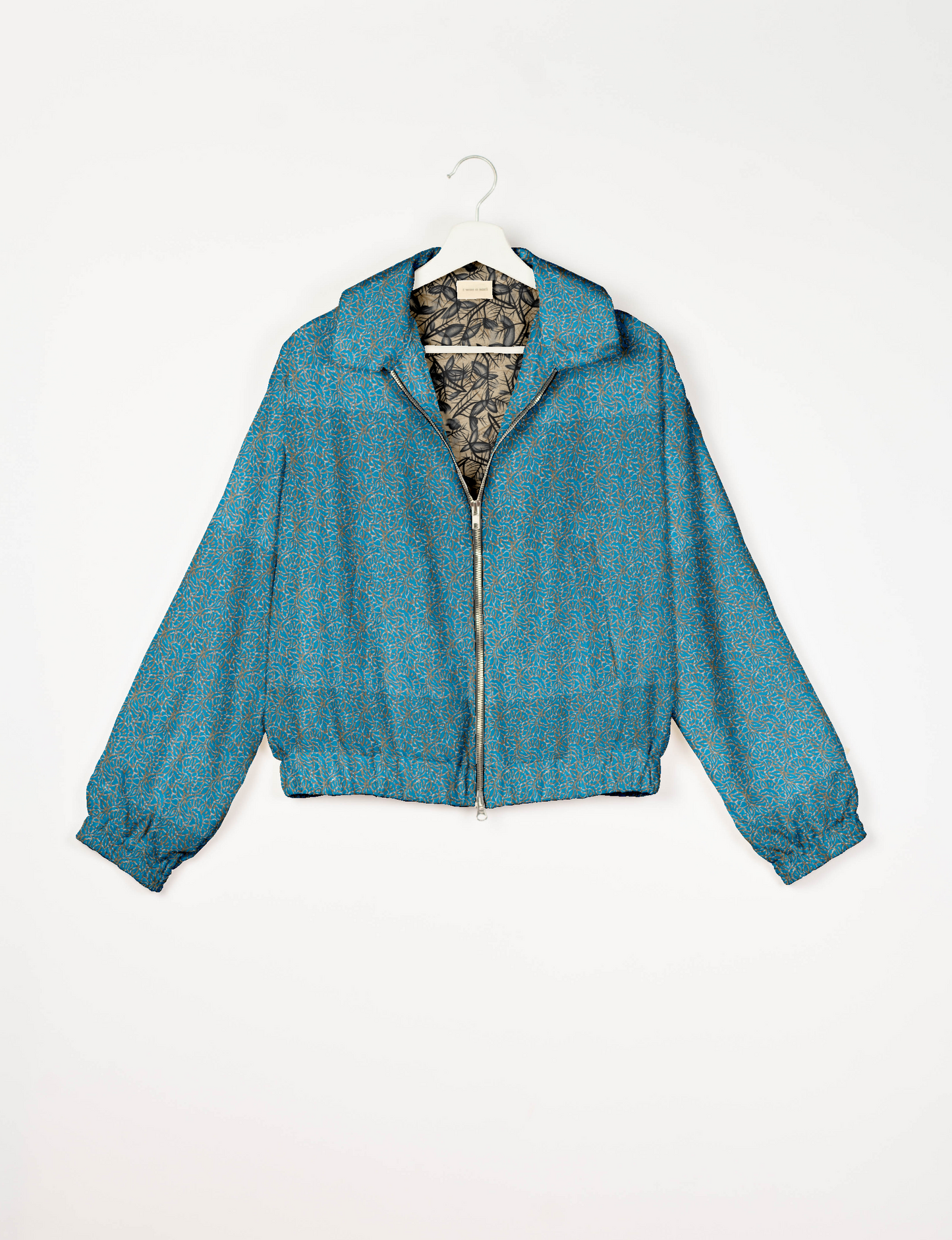 Upcycled Bomber Jacket made from recycled sari materials, featuring a cute cropped shape, elasticated hem and cuffs, and contrast sari print lining. Sustainable apparel promoting eco-friendly fashion and ethical clothing.