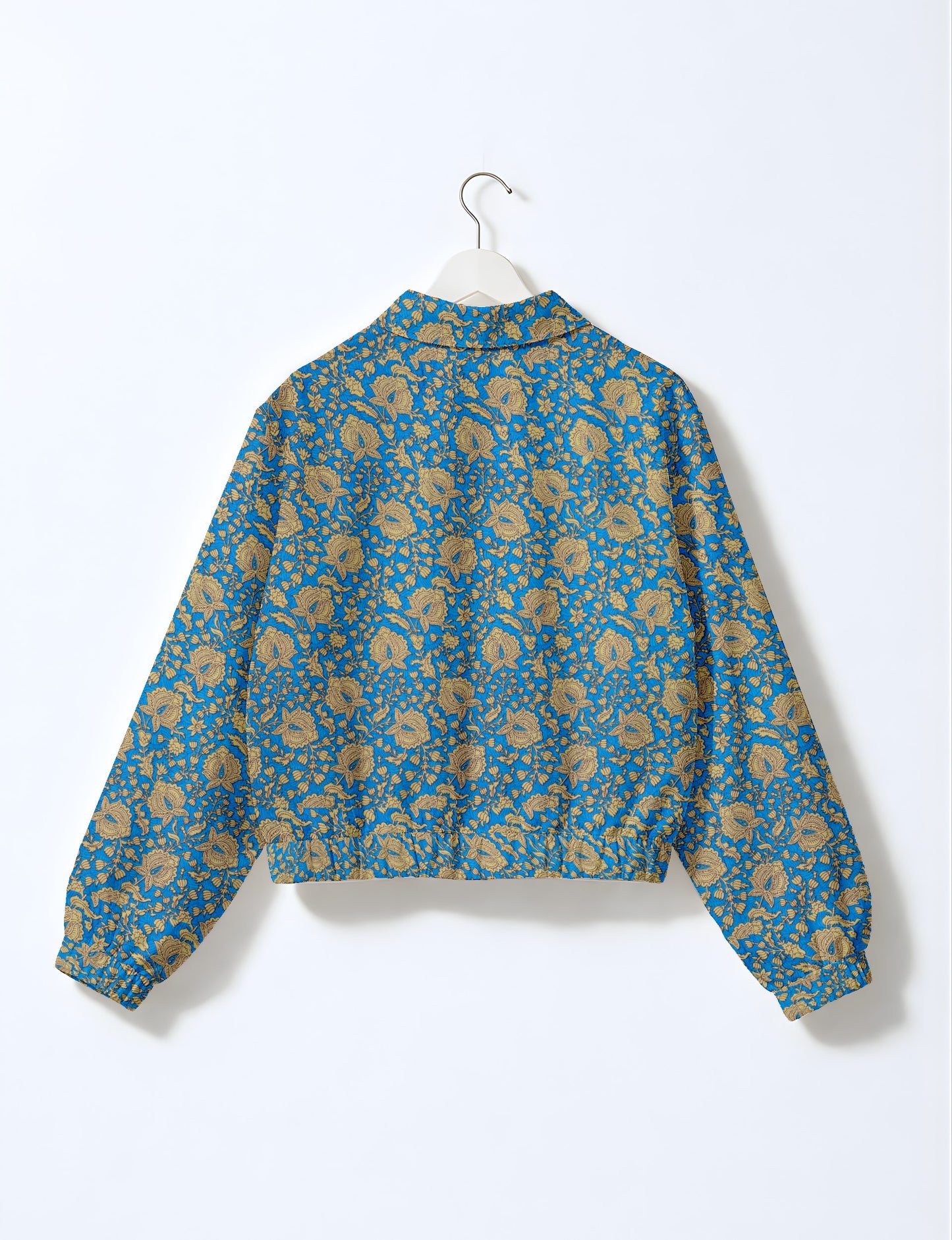 Upcycled Bomber Jacket made from recycled sari materials, featuring a cute cropped shape, elasticated hem and cuffs, and contrast sari print lining. Sustainable apparel promoting eco-friendly fashion and ethical clothing.