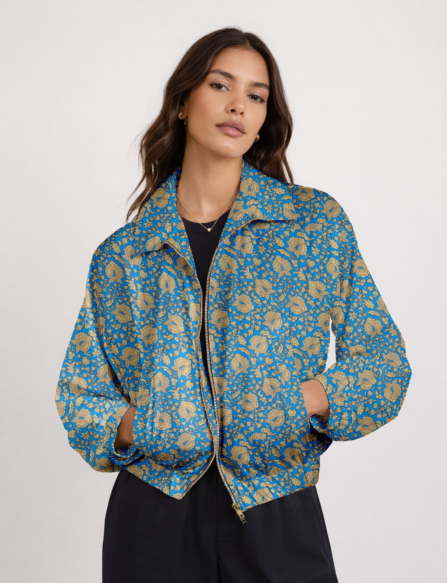 Upcycled Bomber Jacket made from recycled sari materials, featuring a cute cropped shape, elasticated hem and cuffs, and contrast sari print lining. Sustainable apparel promoting eco-friendly fashion and ethical clothing.