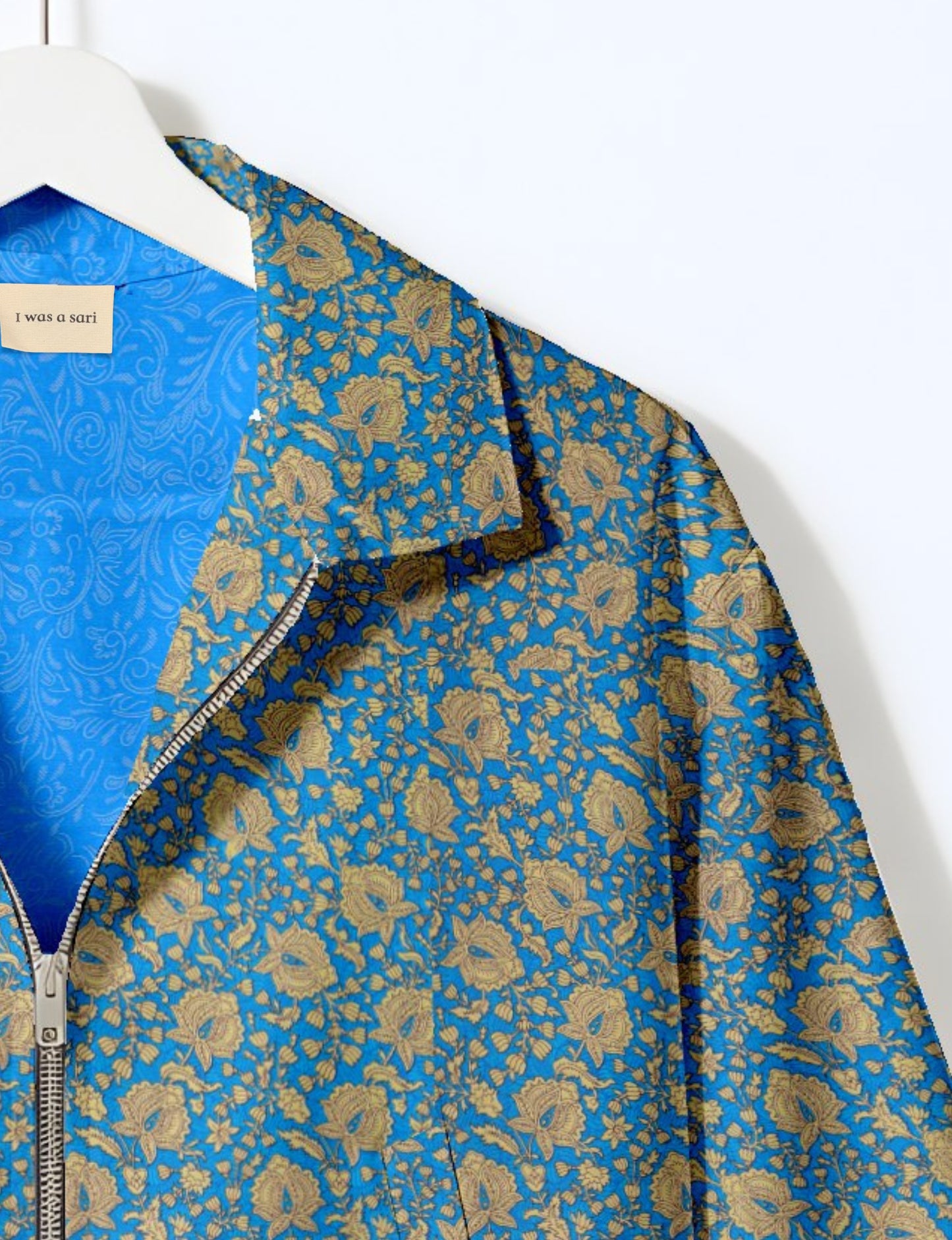 Upcycled Bomber Jacket made from recycled sari materials, featuring a cute cropped shape, elasticated hem and cuffs, and contrast sari print lining. Sustainable apparel promoting eco-friendly fashion and ethical clothing.